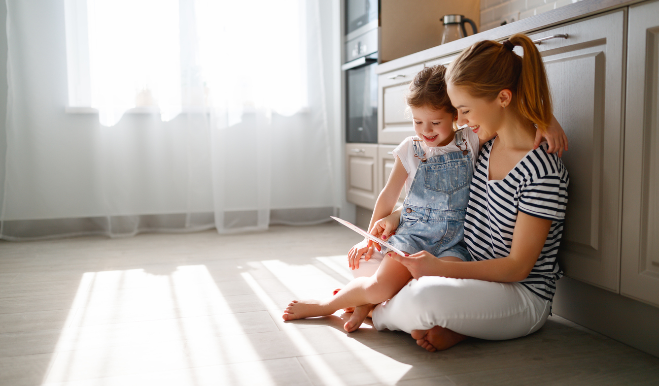 Mom and Daughter looking at paper